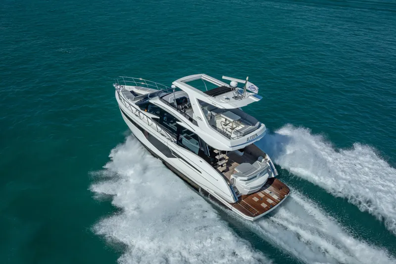 Slide: The Image of 2021 Galeon 500 Fly yacht cruising on open water, aerial view. - 21