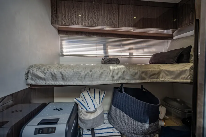 Slide: The Image of 2021 Galeon 500 Fly yacht interior cabin with bunk bed and storage baskets. - 28