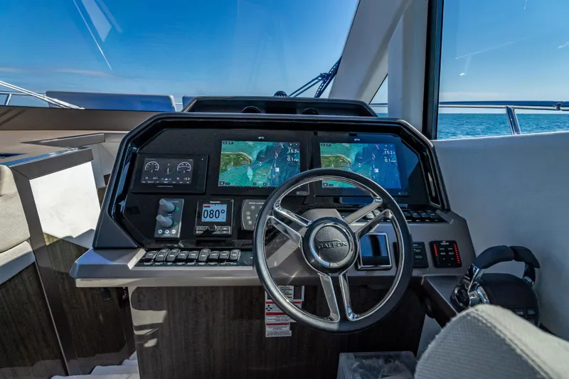 Slide: The Image of Cockpit of 2021 Galeon 500 Fly yacht with advanced navigation systems and steering wheel. - 43