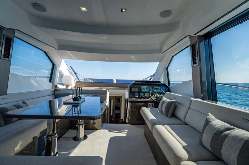 Slide: The Image of Luxurious interior of 2021 Galeon 500 Fly yacht with modern seating and ocean view. - 38