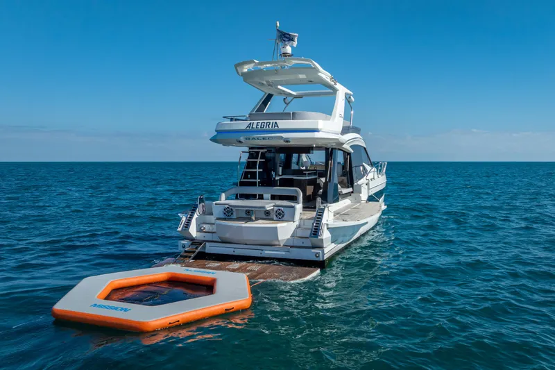Slide: The Image of 2021 Galeon 500 Fly yacht on open sea with floating platform. - 63
