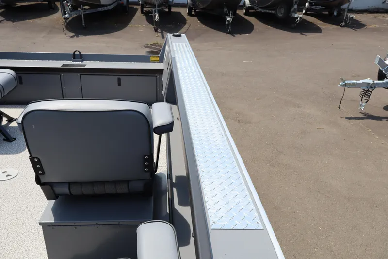 Slide: The Image of 2026 Alumaweld Columbia 21 boat interior with seating and diamond plate flooring. - 21