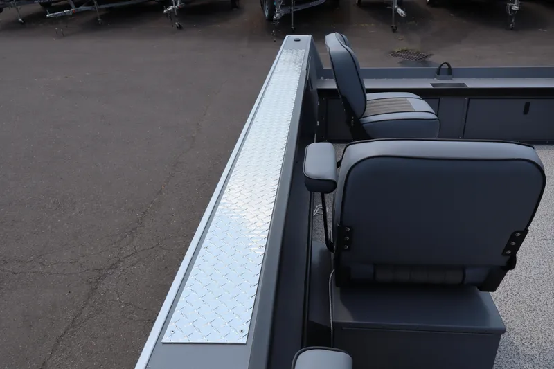 Slide: The Image of 2026 Alumaweld Columbia 21 boat interior with seating and diamond plate flooring. - 22