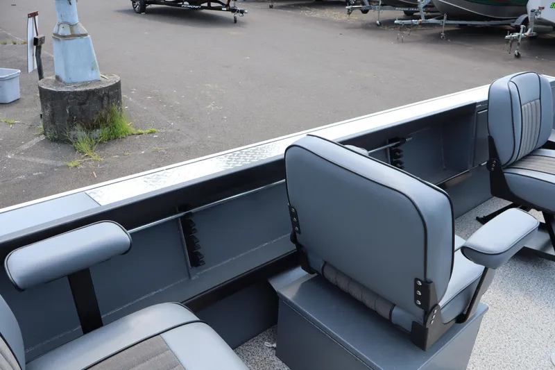 Slide: The Image of 2026 Alumaweld Columbia 21 boat interior with gray seating and armrests. - 24