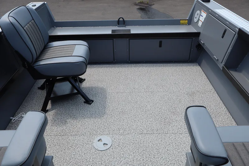 Slide: The Image of Interior of 2026 Alumaweld Columbia 21 boat with seating and storage compartments. - 25