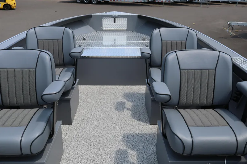 Slide: The Image of 2026 Alumaweld Columbia 21 boat interior with four gray cushioned seats and textured flooring. - 12