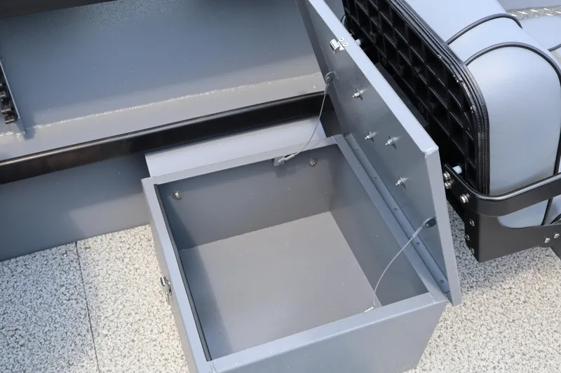 Slide: The Image of Open storage compartment in 2026 Alumaweld Columbia 21 boat, showcasing interior design. - 13