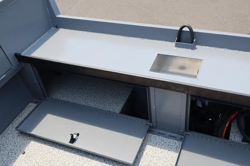 Slide: The Image of Interior view of 2026 Alumaweld Columbia 21 boat, showcasing storage compartments and sleek design. - 11