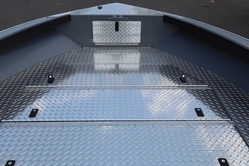 Slide: The Image of Alumaweld Columbia 21 boat deck, 2026 model, featuring diamond plate flooring. - 14