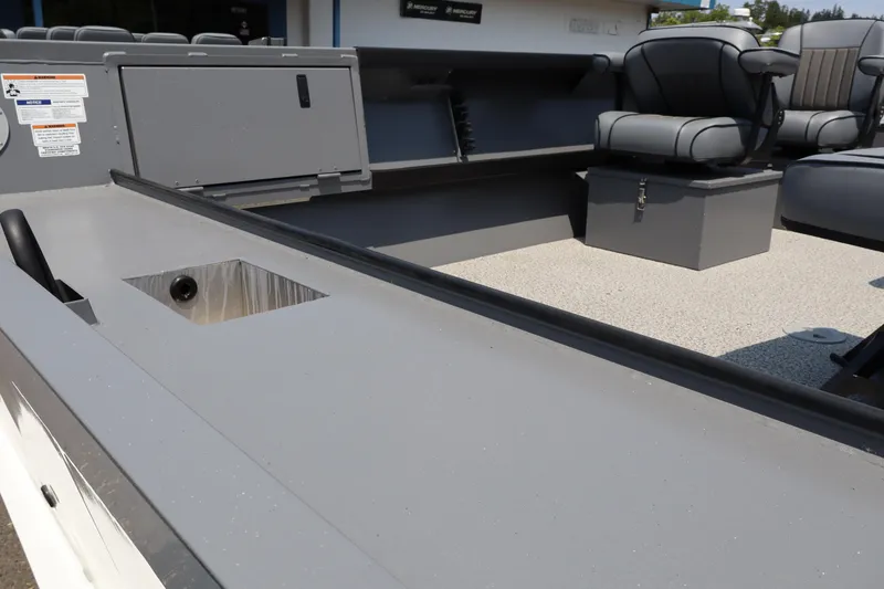 Slide: The Image of 2026 Alumaweld Columbia 21 boat interior with seating and storage compartments. - 5