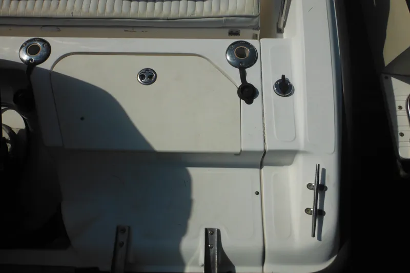 Slide: The Image of 2003 Boston Whaler 220 Dauntless boat deck with seating and hardware details. - 35