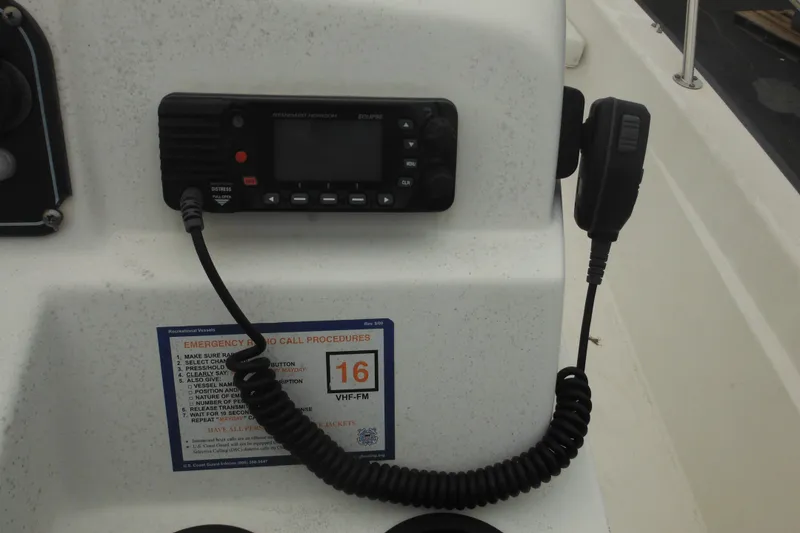 Slide: The Image of VHF radio and emergency call procedures on 2003 Boston Whaler 220 Dauntless boat. - 30