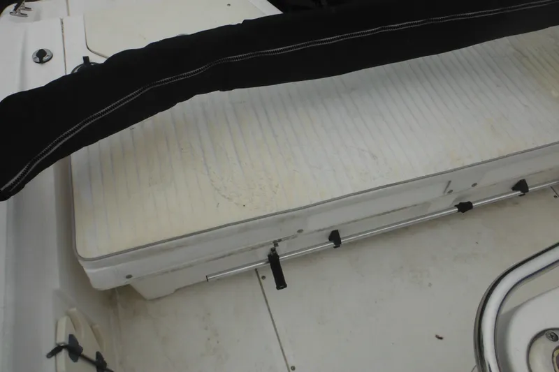 Slide: The Image of 2003 Boston Whaler 220 Dauntless boat interior with seating and storage area. - 21