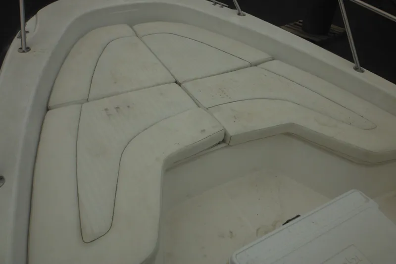 Slide: The Image of Bow seating area of a 2003 Boston Whaler 220 Dauntless boat. - 24