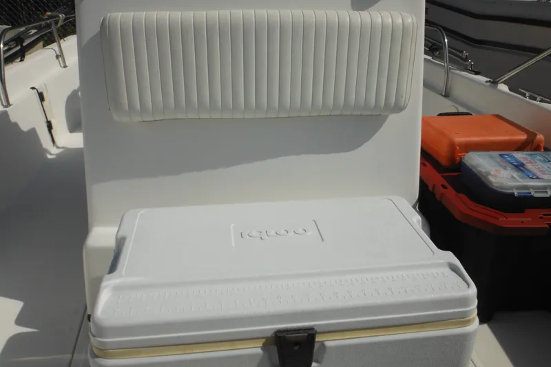 Slide: The Image of 2003 Boston Whaler 220 Dauntless boat interior with cooler and storage boxes. - 43
