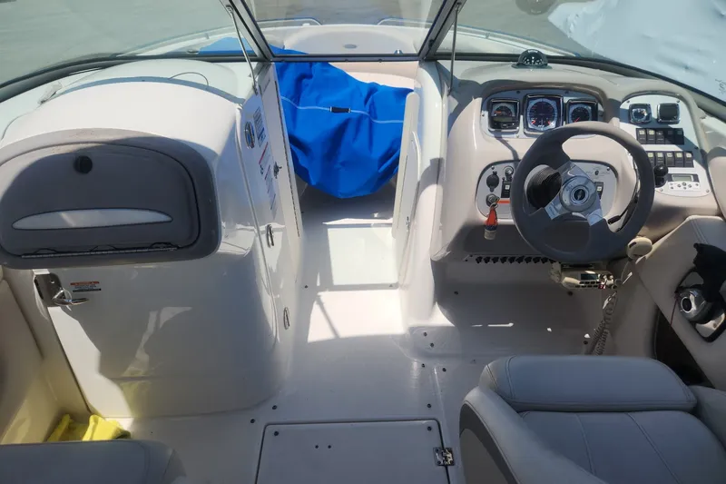 Slide: The Image of 2008 Chaparral 246 SSi boat interior with steering wheel and dashboard controls. - 7