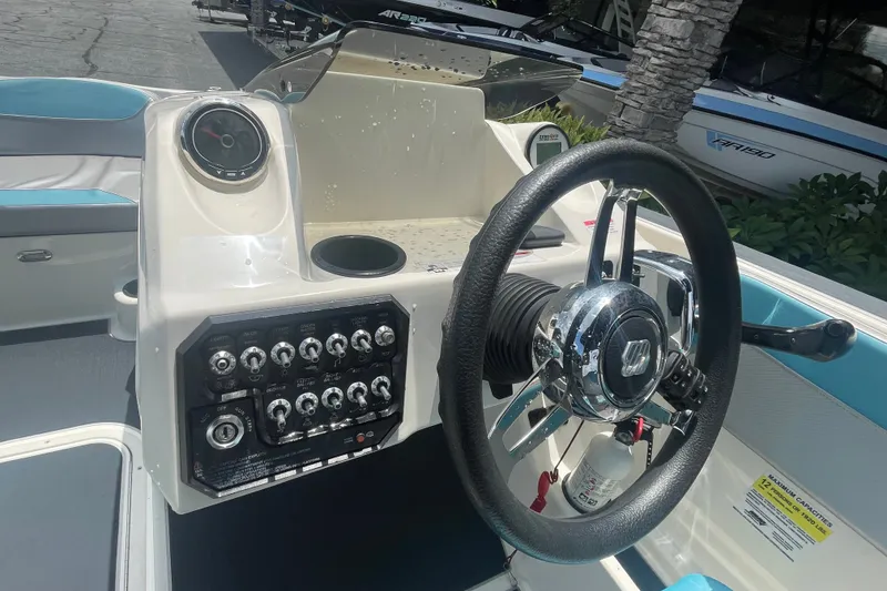 Slide: The Image of Steering console of a 2017 Heyday WT-2 boat with control panel and wheel. - 3