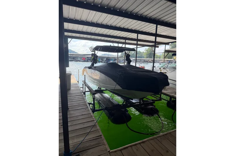 Slide: The Image of 2017 Heyday WT-2 boat covered and docked in a marina. - 19