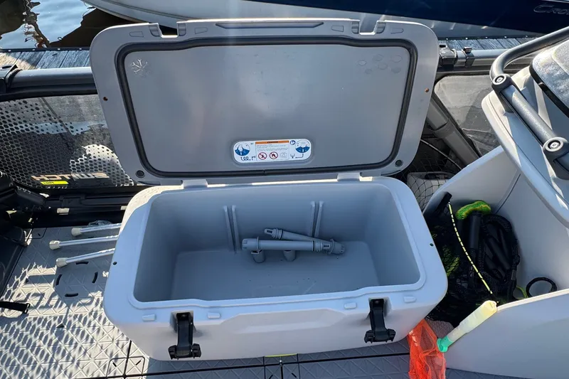 Slide: The Image of Open storage compartment on 2025 Sea-Doo Switch Fish 21, showcasing interior space and accessories. - 7