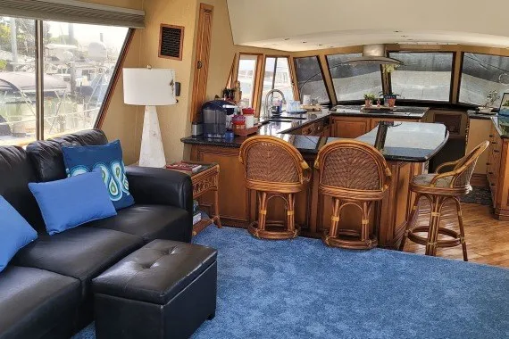 Slide: The Image of Luxurious 1978 Symbol Double Deck Cockpit yacht interior with seating and kitchen area. - 15