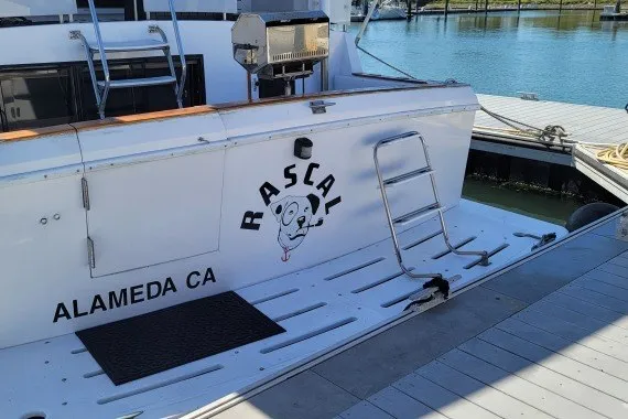 Slide: The Image of 1978 Symbol Double Deck Cockpit MY - 68' boat named "Rascal" docked in Alameda, CA. - 4