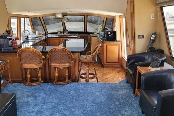 Slide: The Image of Luxurious 1978 Symbol Double Deck Cockpit yacht interior with bar and seating area. - 14