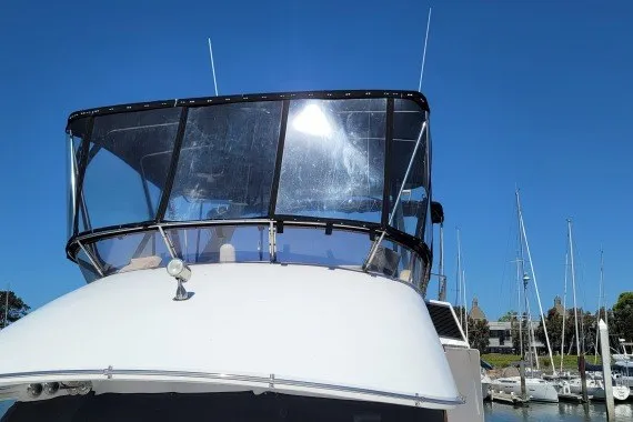 Slide: The Image of 1978 Symbol Double Deck Cockpit MY - 68' yacht docked under clear blue sky. - 3