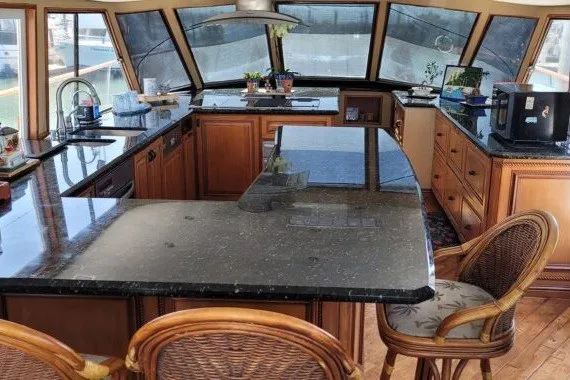 Slide: The Image of Luxurious yacht interior with modern kitchen, featuring granite countertops and panoramic windows, 1978 Symbol model. - 11