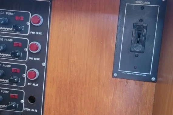 Slide: The Image of Control panel of a 1978 Symbol Double Deck Cockpit MY - 68' yacht, featuring bilge pump switches. - 9