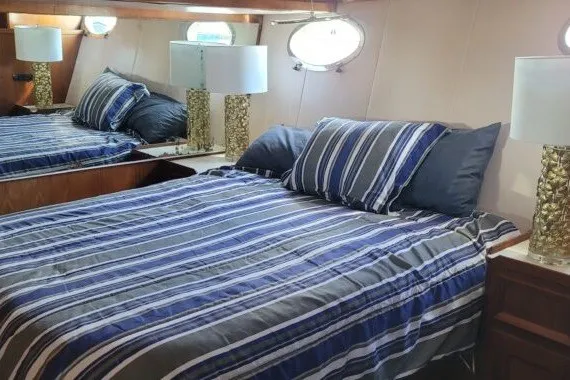 Slide: The Image of Cozy bedroom in 1978 Symbol Double Deck Cockpit MY yacht with striped bedding. - 8