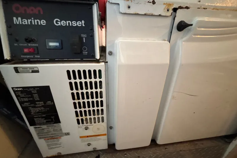 Slide: The Image of Onan Marine Genset in 1987 Symbol MS Super Sedan - 60', showing control panel and casing. - 17