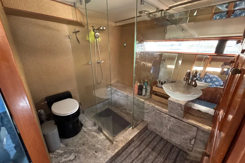 Slide: The Image of Luxurious 1987 Symbol MS Super Sedan yacht bathroom with glass shower and modern fixtures. - 15