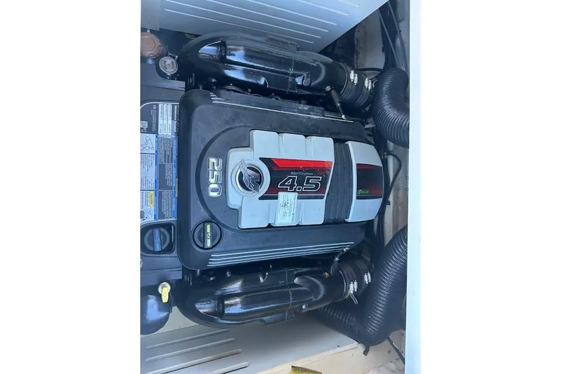 Slide: The Image of 2022 Sea Ray SPX 210 engine compartment with MerCruiser 4.5L 250 HP engine. - 21