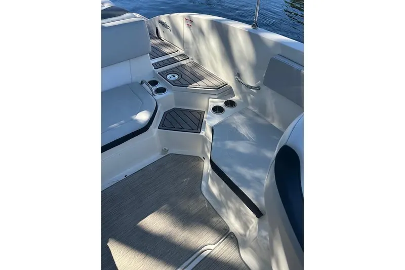 Slide: The Image of Interior of 2022 Sea Ray SPX 210 boat with seating and cup holders. - 13