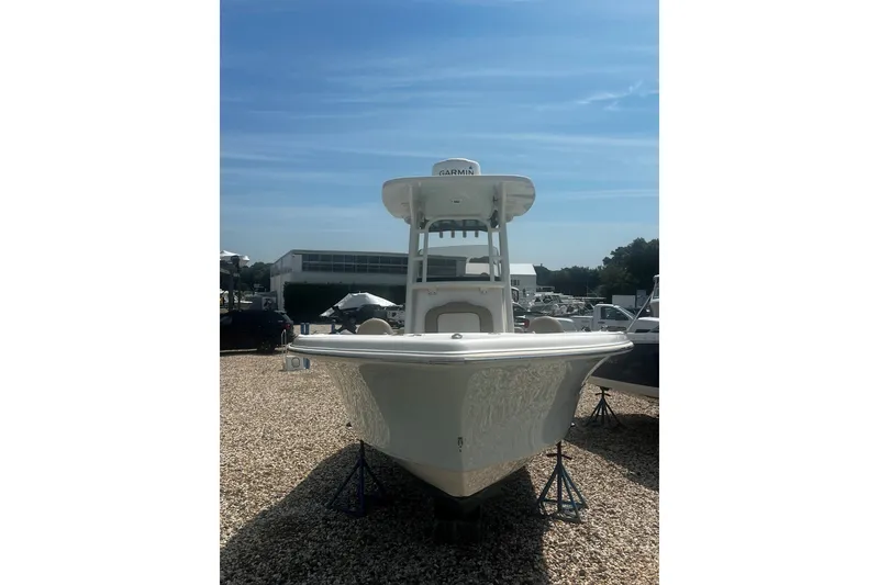 Slide: The Image of 2019 Key West 239 FS boat on display, front view under clear blue sky. - 15