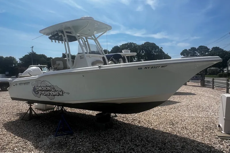 Slide: The Image of 2019 Key West 239 FS boat on display with "Smokin Fishermen" graphic. - 1