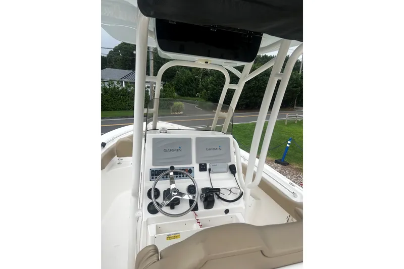 Slide: The Image of 2019 Key West 239 FS boat dashboard with Garmin navigation system and steering wheel. - 7