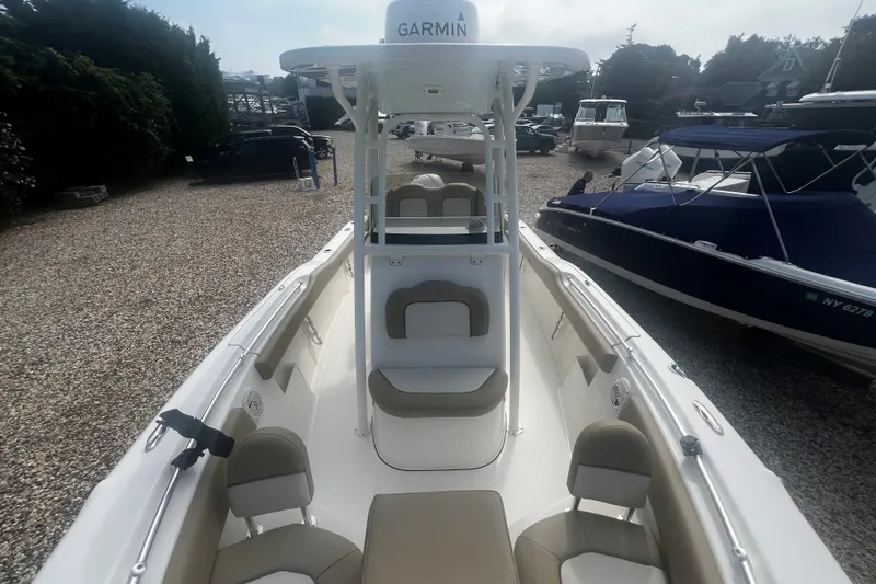 Slide: The Image of 2019 Key West 239 FS boat with Garmin equipment, docked among other vessels. - 11