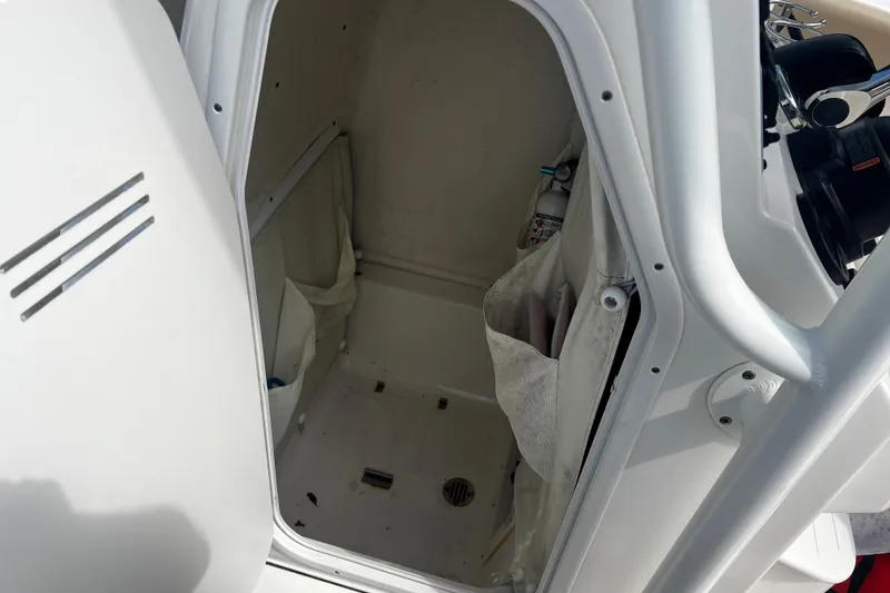 Slide: The Image of Interior view of a 2019 Key West 239 FS boat compartment with storage space. - 10