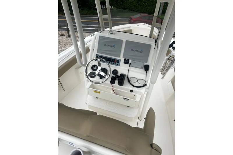 Slide: The Image of 2019 Key West 239 FS boat console with Garmin navigation system and steering wheel. - 8