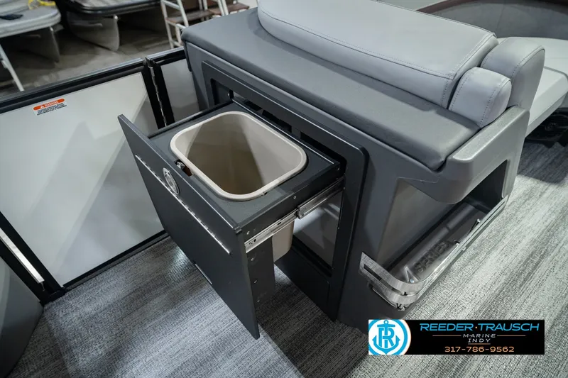 Slide: The Image of 2027 Bennington 22 MSB boat interior with pull-out storage compartment and seating. - 33