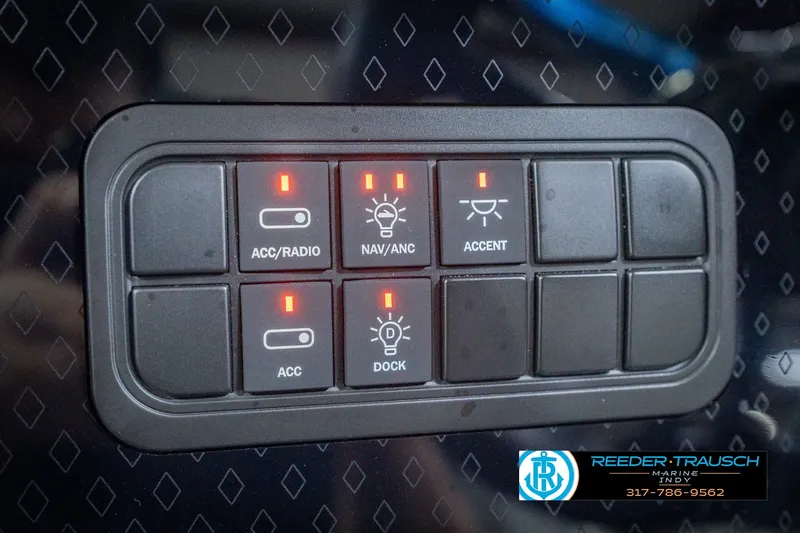 Slide: The Image of Control panel of 2027 Bennington 22 MSB boat with illuminated switches. - 44