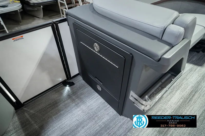 Slide: The Image of 2027 Bennington 22 MSB boat interior with sleek seating and storage compartment. - 32