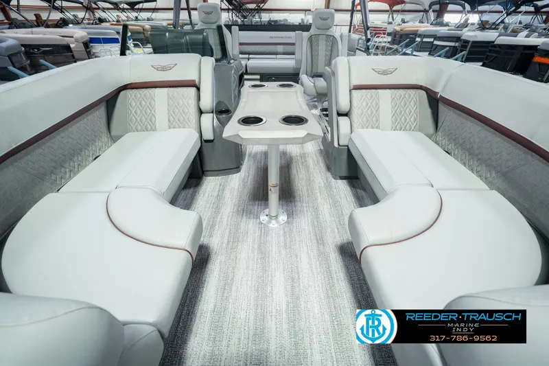 Slide: The Image of Luxurious interior of 2027 Bennington 22 MSB pontoon boat with plush seating and table. - 18