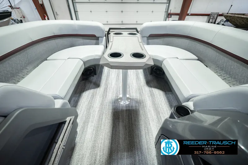 Slide: The Image of Interior of 2027 Bennington 22 MSB pontoon boat with plush seating and table. - 25