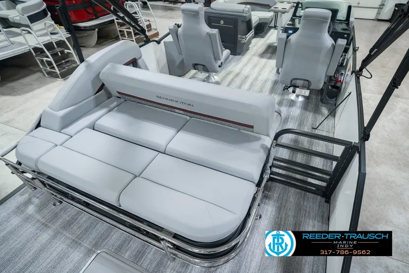 Slide: The Image of 2027 Bennington 22 MSB pontoon boat interior with plush seating and modern design. - 16