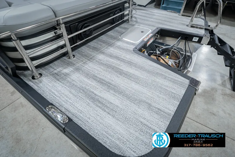 Slide: The Image of 2027 Bennington 22 MSB pontoon boat deck with gray flooring and seating. - 60