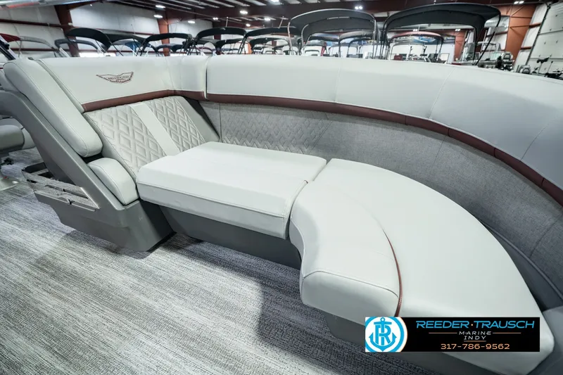 Slide: The Image of Luxurious seating on a 2027 Bennington 22 MSB pontoon boat in showroom. - 49