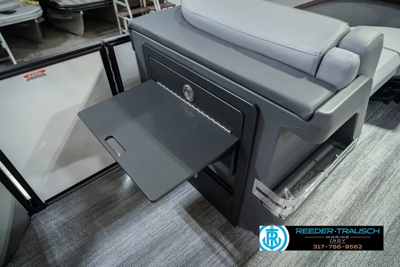 Slide: The Image of 2027 Bennington 22 MSB boat interior with fold-out table and seating. - 34