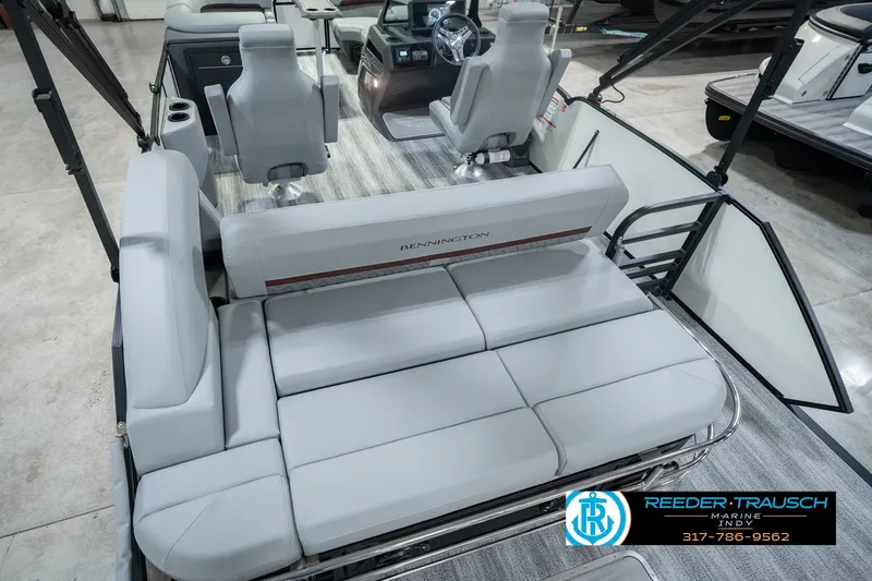 Slide: The Image of 2027 Bennington 22 MSB boat interior with plush seating and modern helm design. - 17